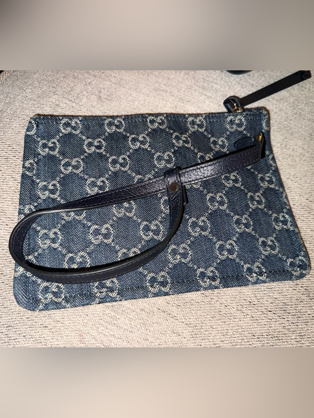 Gucci Blue GG Denim wristlet.